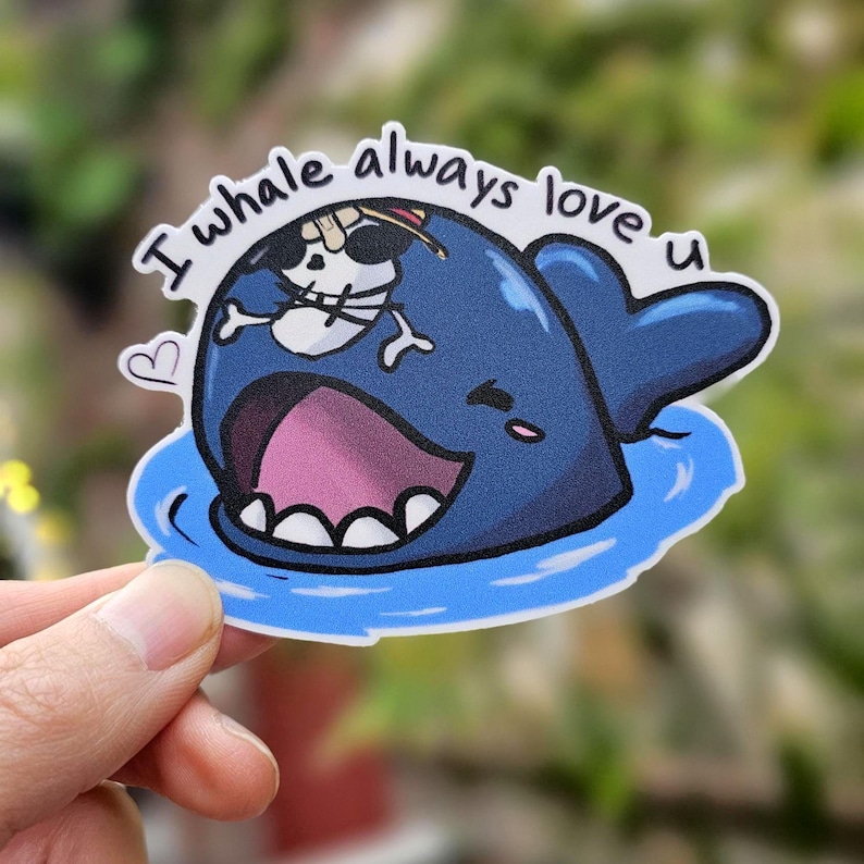 May include: A blue whale with a skull and crossbones on its back, with the text "I whale always love u" above it. The whale is smiling and has a heart next to it.