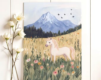 May include: A whimsical illustration of a white pony in a field of wildflowers with a mountain backdrop. The artwork features a light blue sky, green grass, and pink and yellow flowers. Black birds fly in the sky.