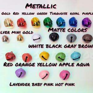 May include: Assortment of jingle bells in various colors, including metallic silver, gold, red, yellow, green, turquoise, royal blue, purple, pink, white, black, gray, brown, orange, apple green, aqua, lavender, baby pink, and hot pink. The bells are arranged in rows with their corresponding color names labeled below.