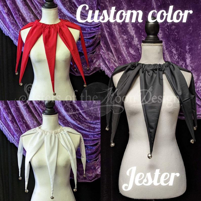 May include: Three jester collars in red, black, and white. Each collar has a gathered neckline and five points with bells at the ends. The collars are displayed on mannequins against a purple velvet background. The text "Custom color" and "Jester" are visible in the image.