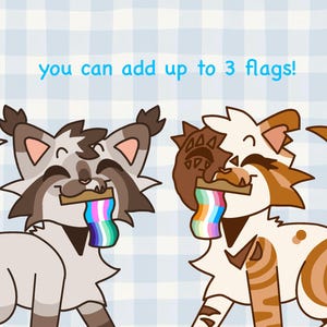 Pu&ograve; includere: Illustrazione di tre gatti dei cartoni animati con bandiere arcobaleno in bocca. Il testo "you can add up to 3 flags!" &egrave; scritto in blu sopra i gatti. Lo sfondo &egrave; a quadretti azzurri.