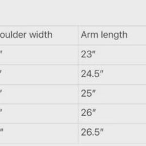 May include: A jacket sizing chart with measurements in inches. The chart includes sizes from Small to 2XL, listing shoulder width, arm length, and waist measurements. The smallest size has a 16-inch shoulder width, 23-inch arm length, and 17.5-inch waist.