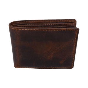 May include: A brown leather wallet with a distressed finish. The wallet is rectangular and folded, with visible stitching around the edges. The leather has a rich, textured appearance.