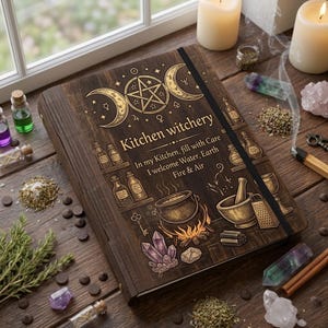 May include: A wooden journal with the words "Kitchen witchery" and illustrations of potion bottles, a cauldron, and crystals. The journal is open on a wooden table with candles and herbs.