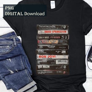 May include: Black t-shirt featuring a stack of vintage cassette tapes with band names like Bruce Springsteen, Guns N' Roses, and AC/DC. The shirt is paired with blue jeans and black sneakers. The words "PNG DIGITAL Download" are in the top left corner.