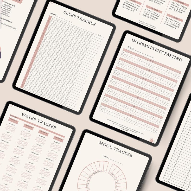 May include: A collection of digital planner pages displayed on tablets, featuring trackers for sleep, intermittent fasting, water intake, and mood. Each page has a clean layout with soft pink accents, clear headings, and organized grids for daily logging.