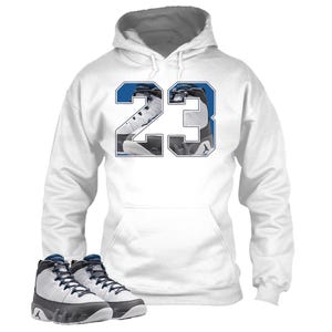 May include: White hoodie with a blue and white graphic of the number 23. The number 23 graphic features a pair of white and blue sneakers. A pair of white, black, and blue sneakers are at the bottom of the image.