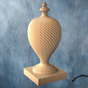 May include: A wooden decorative vase with a spiral design. The vase has a bulbous body and a slender neck, topped with a small finial. It sits on a square wooden base. The wood has a natural, light brown color.