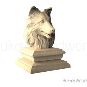 May include: A wooden sculpture of a dog's head atop a tiered base. The dog's fur is intricately carved, and the sculpture is made of light-colored wood. The text "Bukata Woodwork" is visible in the image.