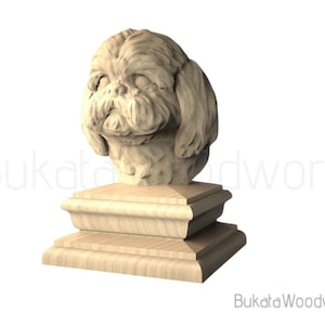 May include: A wooden sculpture of a dog's head, likely a Shih Tzu, atop a tiered base. The sculpture is light brown and appears to be carved from a single piece of wood. The dog's features are detailed, with visible fur and facial expressions. The base is rectangular.