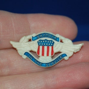 Brother in the Service ~ Early World War II Pin. ~ US Plastic Pin, Depicts a Winged Federal Shield in USA Patriotic Colors