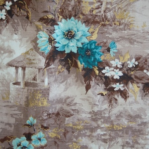 May include: A vintage fabric with a brown background and a repeating pattern of blue and teal flowers, brown leaves, and a small white gazebo.