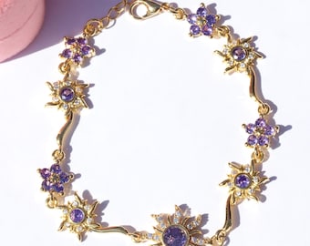 Bracciale sole placcato oro, ciondolo fiore viola, principessa delle fiabe