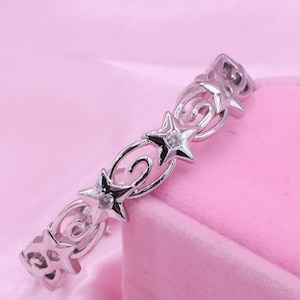 Rhodium Plated Star and Comet Charm Bracelet