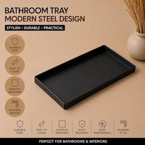 Könnte beinhalten: Ein rechteckiges Badezimmertablett aus schwarzem Stahl mit flachem Boden und erhöhten Kanten. Das Bild enthält den Text: BATHROOM TRAY MODERN STEEL DESIGN, STYLISH, DURABLE, PRACTICAL, DURABLE STEEL, EASY TO CLEAN, SCRATCH RESISTANT, MODERN DESIGN, RUST RESISTANT, EASY MAINTENANCE.