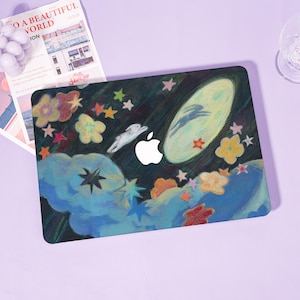 May include: A laptop case featuring a whimsical night sky design. The case showcases a dark background with colorful stars, clouds, and flowers. A rabbit leaps towards a full moon. The Apple logo is visible.