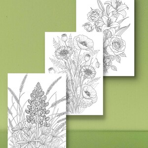 May include: Three black and white floral coloring pages featuring detailed line drawings of various flowers. The pages include images of roses, lilies, poppies, and other wildflowers, perfect for creative coloring projects.