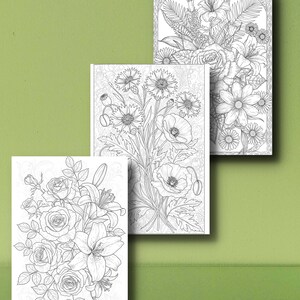 May include: Three floral coloring book pages with detailed line art of various flowers, including roses, lilies, daisies, and poppies. The pages are arranged on a green background, showcasing the intricate designs ready for coloring.