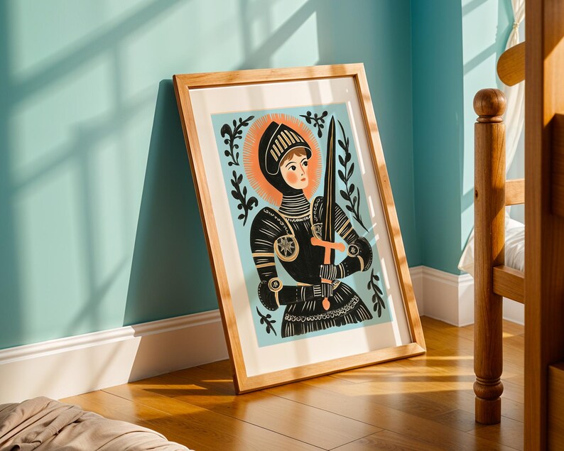 May include: A framed art print featuring a stylized illustration of a knight in black armor holding a sword and cross. The knight has a halo and is set against a light blue background with floral accents. The artwork is in a wooden frame.