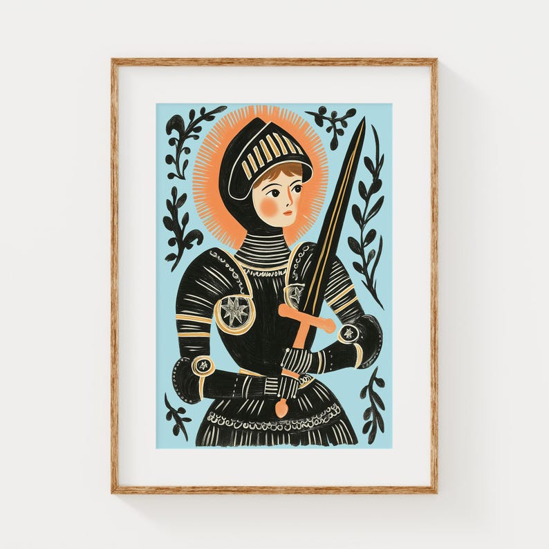May include: Illustration of a person in black armor holding a sword, set against a light blue background. The artwork features a gold halo and decorative black foliage. The framed print has a wooden frame.