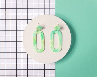 pastel green watercolor effect handmade polymer clay earrings. modern, minimal light green, mint and white textured statement dangles