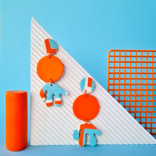 orange and light blue geometric handmade polymer clay earrings. modern memphis minimal geometrical patterned statement dangle earrings