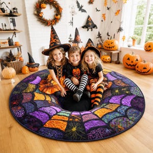 May include: A round, quilted Halloween-themed rug featuring a vibrant spiderweb pattern in shades of purple, orange, and black. The rug is decorated with intricate stitched details, including small spider motifs and swirling textures throughout the fabric.