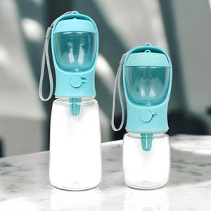 Botella portátil 2 en 1 para agua y comida de mascotas: a prueba de fugas, ideal para viajes, ideal para perros y gatos. Contenedor para beber y comer al aire libre.