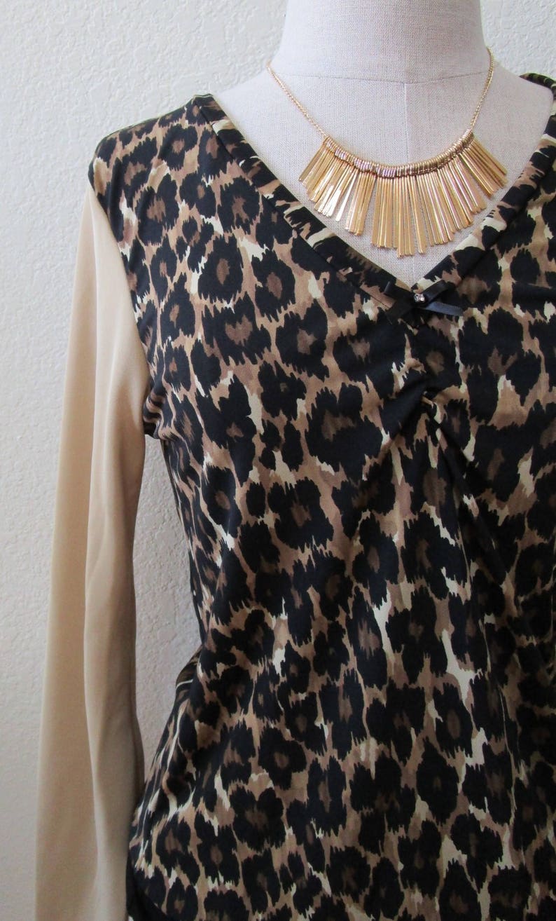 Leopard pattern print with brown, black and cream color and oatmeal color for the sleeves top plus made in USA v131 image 4