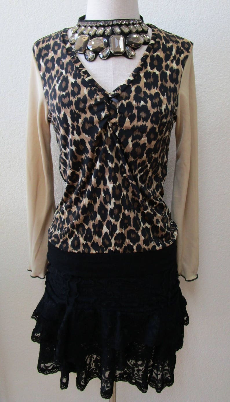 Leopard pattern print with brown, black and cream color and oatmeal color for the sleeves top plus made in USA v131 image 1