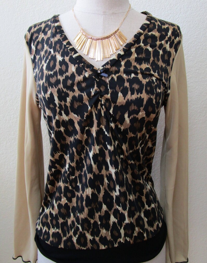 Leopard pattern print with brown, black and cream color and oatmeal color for the sleeves top plus made in USA v131 image 2