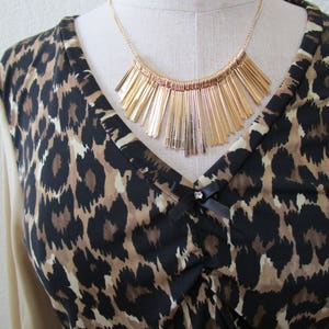 Leopard pattern print with brown, black and cream color and oatmeal color for the sleeves top plus made in USA v131 image 3