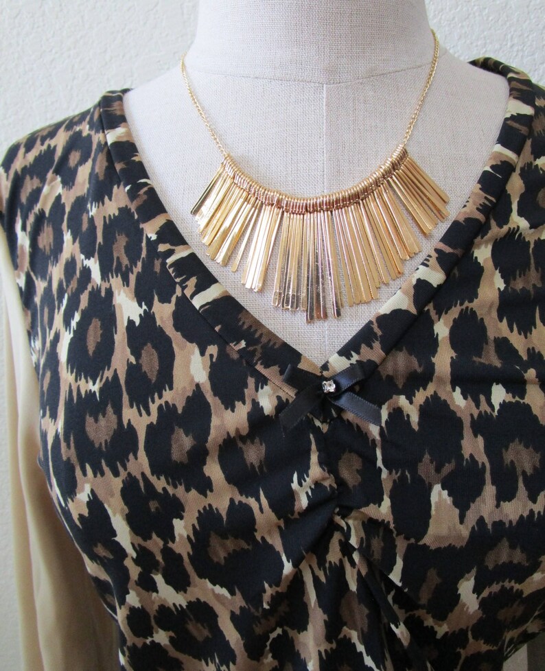 Leopard pattern print with brown, black and cream color and oatmeal color for the sleeves top plus made in USA v131 image 3