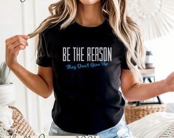 Camiseta con cita motivacional: vibras positivas, tipografía inspiradora.