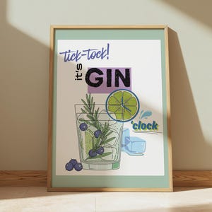 May include: A framed wall art print featuring a glass of gin with ice cubes, a lime slice, rosemary sprigs, and blueberries. The text reads tick-tock! it's GIN 'clock. The design uses a white background with purple, green, and blue graphic elements.