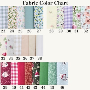 May include: A Fabric Color Chart displaying numbered fabric swatches from 23 to 46. The collection includes various patterns such as gingham, floral prints, solid colors, and seasonal motifs like snowflakes, bears, and Christmas hats.