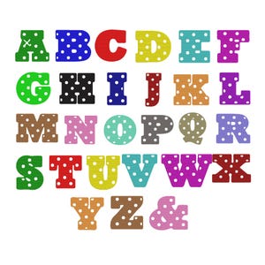 May include: A collection of alphabet letters from A to Z and an ampersand symbol, each featuring a distinct solid color and a repeating white polka dot pattern. The letters are arranged in rows, showcasing a variety of bright and muted hues.