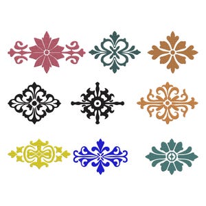 May include: Nine decorative floral and ornamental designs in various colors, including pink, teal, brown, black, yellow, and blue. Each design features intricate details and symmetrical patterns, suitable for embellishments or crafts.