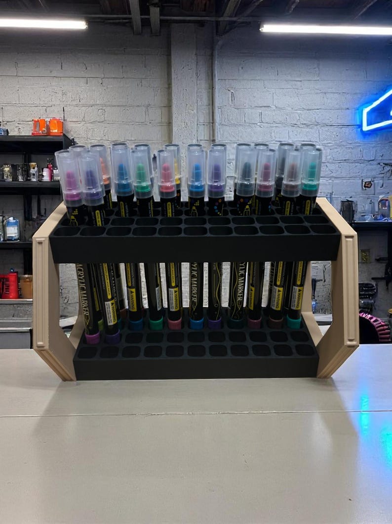 "Marker stand with 44 slots, positioned at an angle for easy access"
