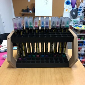 "Hex-sided pen holder showing angled display mode with markers inserted"