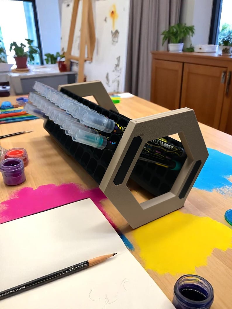 "Acrylic marker organizer with dual-angle stand on workshop desk"