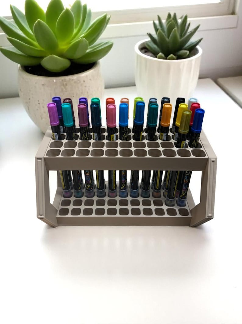 "Front view of 3D printed marker holder with 44 pens neatly arranged"