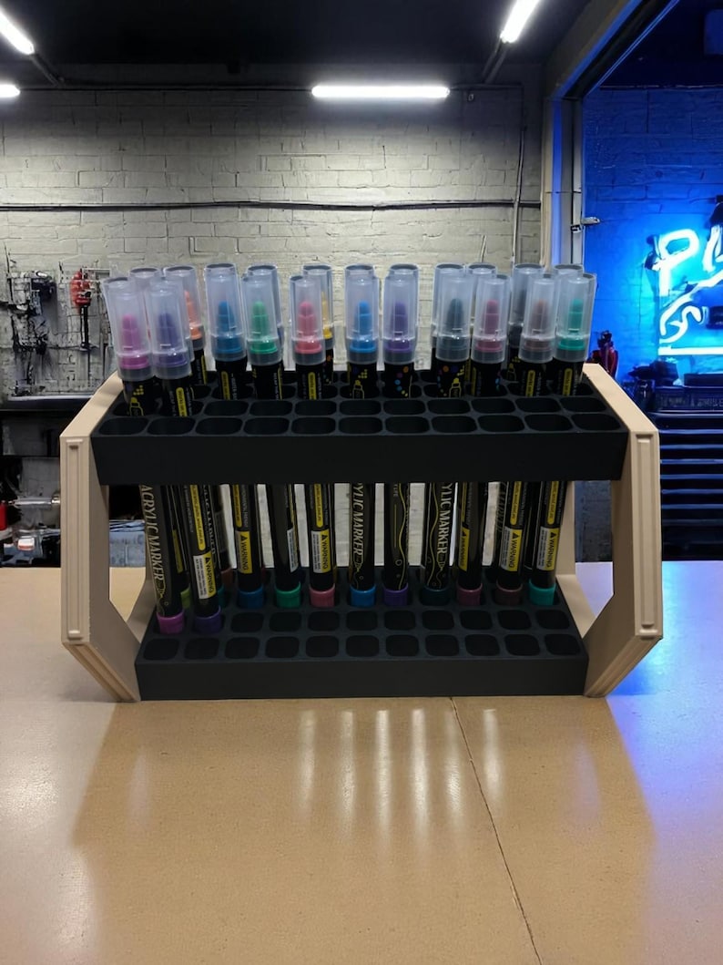 "Creative tool display stand with two rows of paint pens"