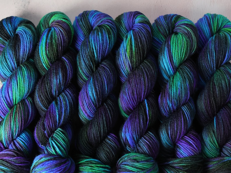 DK British Bluefaced Leicester wool superwash hand-dyed knitting yarn 100g 'Outer Planets' mottled black, purple, turquoise, green, neon image 1