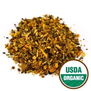 May include: A close-up of a pile of dried herbs and spices, including turmeric, ginger, and other ingredients. The mixture is labelled "USDA Organic".