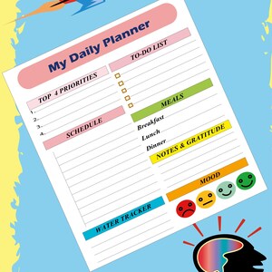 A tilted view of the printable daily planner page set against a blue background with a rocket and a silhouette of a head with a colorful brain.
