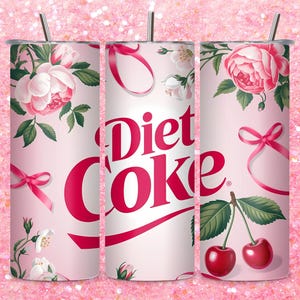 May include: A Diet Coke tumbler with a floral design featuring pink roses, green leaves, and red bows. The tumbler also has the words "Diet Coke" in a bold, red font, and two cherries.