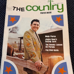 May include: A vintage magazine cover for "The Country" from July 1968, featuring a man in a decorated jacket. The cover includes text such as "Webb Pierce" and "Poster Inside", with blue and orange star accents.