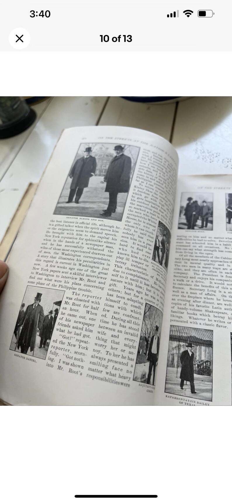May include: An open book with black and white photographs and text. The images show men in suits and top hats. The text is an article about politics and government.
