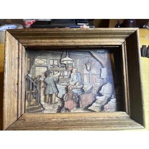 Scatola delle ombre con cornice in carta 3D vintage Anton Pieck "Il venditore di libri"